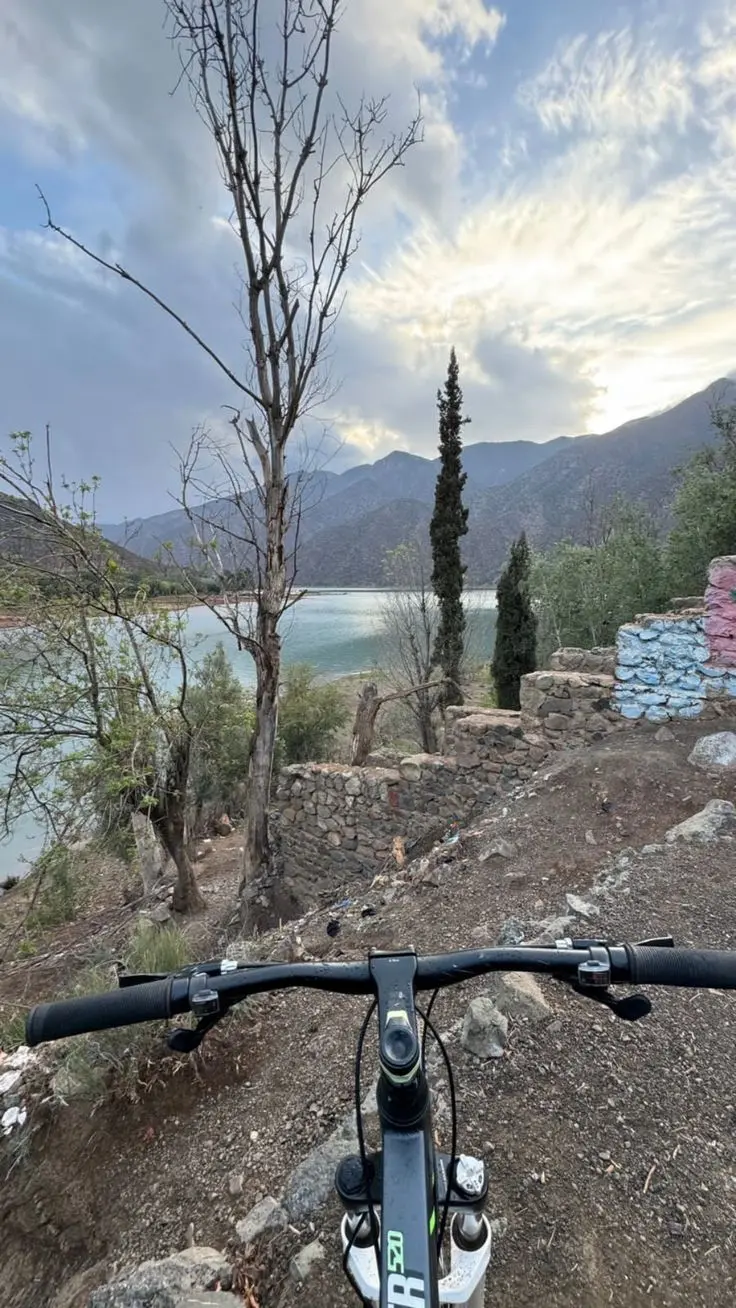 mountain biker riding through Ouirgane valley – raid mtb high atlas